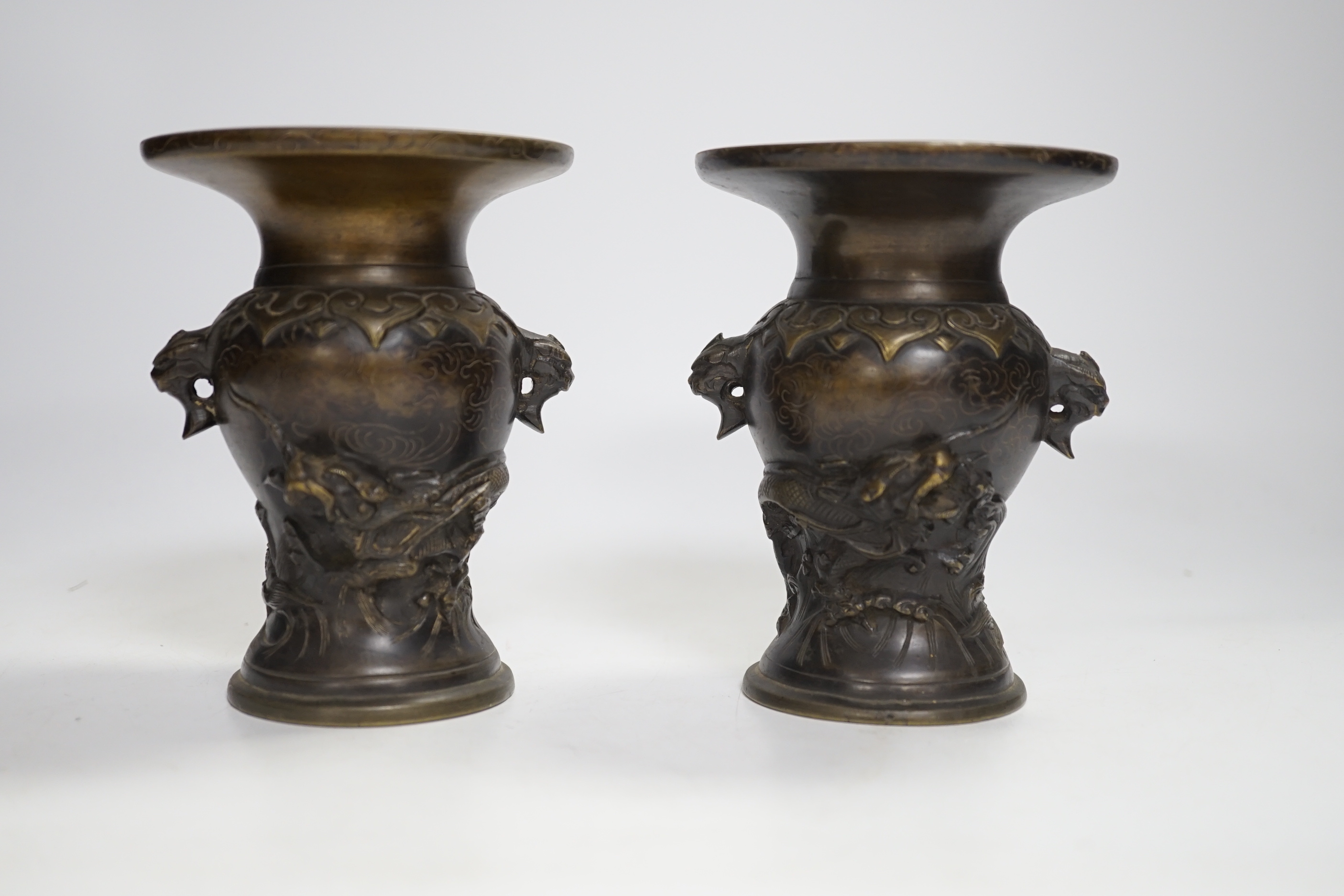 A pair of small Japanese bronze 'dragon' vases, 12.5cm